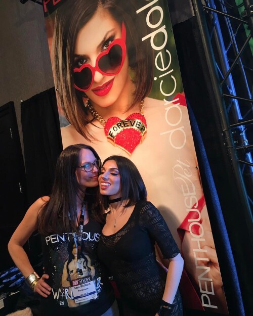 Yesterday with Sam Phillips at AVN signing for Penthouse with my picture behind us! #petsisters #penthousepet
Darcie Dolce