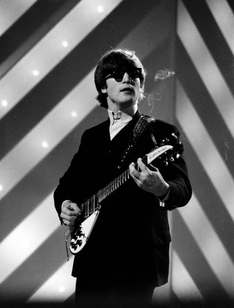 John Lennon (1940-1980) of English rock and pop group The Beatles plays his second Rickenbacker 325 guitar on stage during rehearsals for the ABC Television music television show 'Thank Your Lucky Stars' Summer Spin at Teddington Studios in London on 11th July 1964. The band would go on to play four songs on the show, A Hard Day's Night, Long Tall Sally, Things We Said Today and You Can't Do That. (Photo by David Redfern/Redferns)
